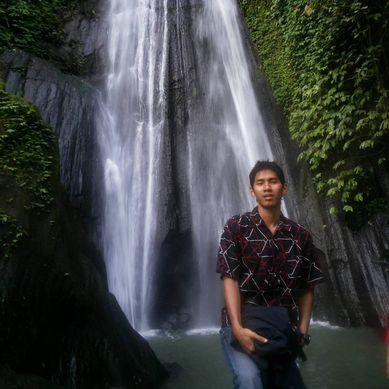 Putra at a waterfall